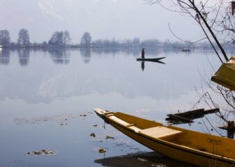 brown wooden boat on lake during daytime